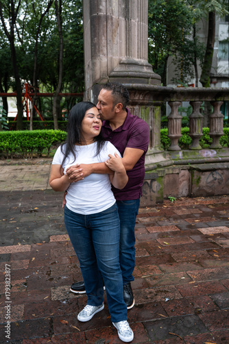Affectionate embrace in lush garden setting