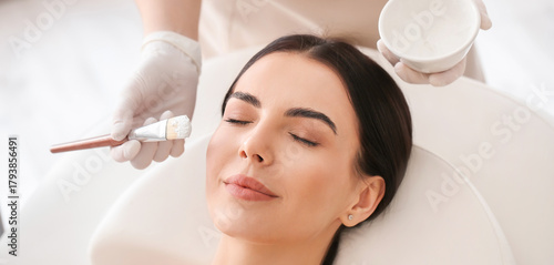 Cosmetologist applying mask...