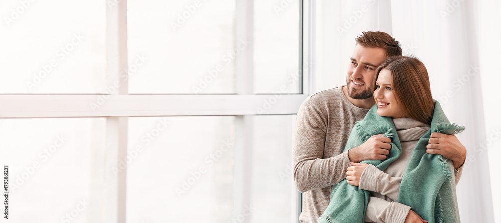 Fototapeta premium Happy couple resting near window at home