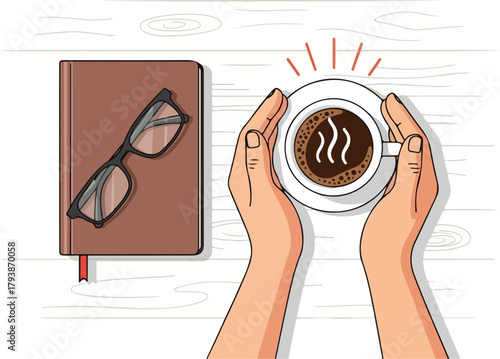 Hands holding a warm cup of coffee next to a notebook and glasses on a wooden table.