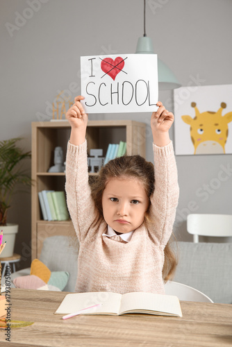 Sad little girl holding pap...