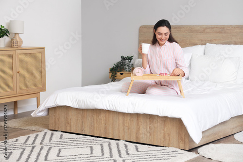 Young woman in striped paja...