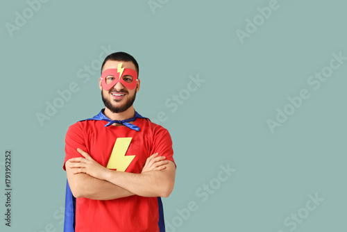 Young man dressed as superh...
