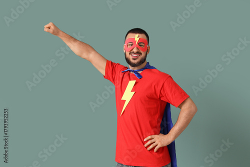 Young man dressed as superh...