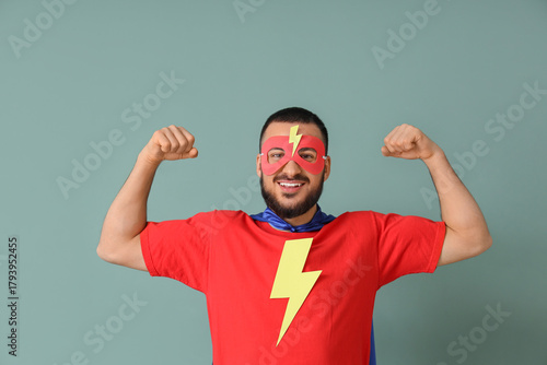 Young man dressed as superh...