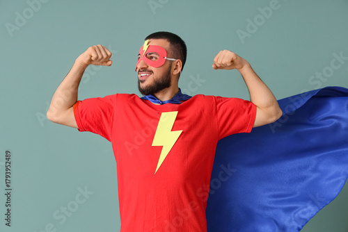 Young man dressed as superh...