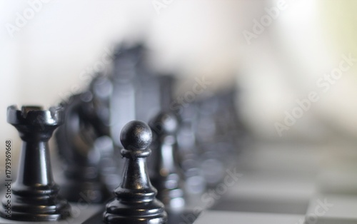 chess pieces on the chess board artistic background game playing competition	
