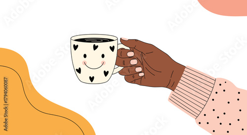 A hand with dark skin holds a cozy coffee mug decorated with hearts and a smiley face, set against a cheerful, abstract background.