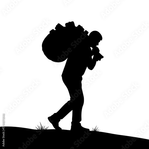 Silhouette of a person carrying a large bag of trash on their shoulder, walking on a grassy hill