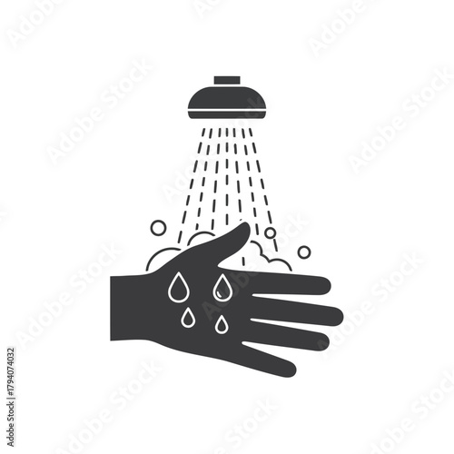 Hand being washed under a shower head with soap bubbles and water drops