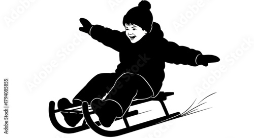Joyful child in winter clothes sledding down a snowy slope.
