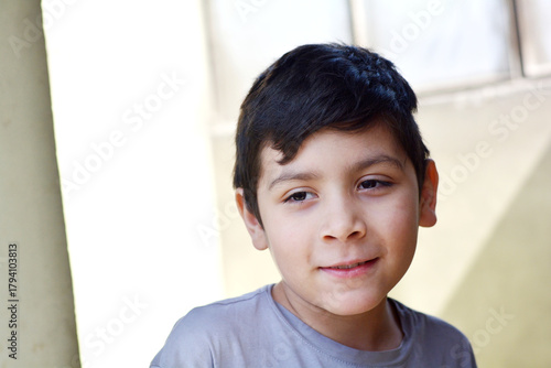 Latin child 10 years old looking glad.
