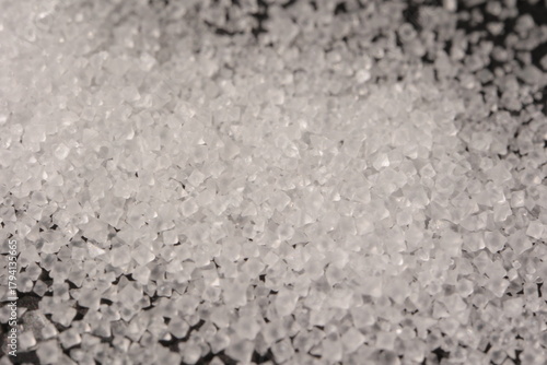 Close-up of the surface of white salt grains, macro salt