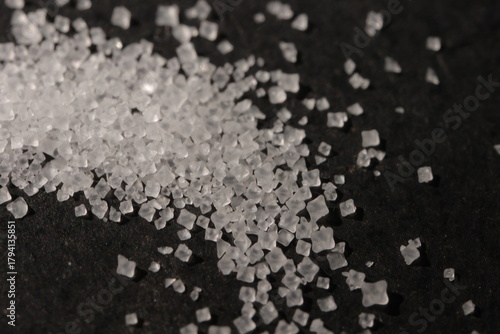 Close-up of the surface of white salt grains, macro salt