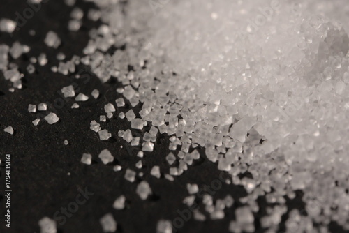 Close-up of the surface of white salt grains, macro salt