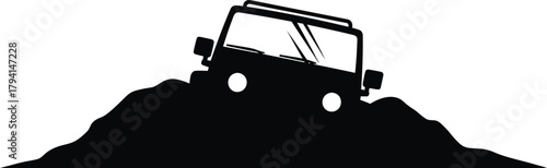 Offroad vehicle climbing a hill, showcasing its ruggedness and capability