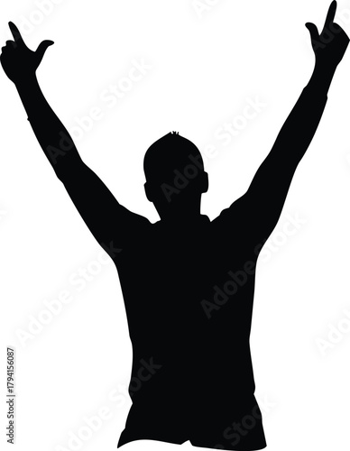 Silhouette of a person celebrating with arms raised in a victorious pose