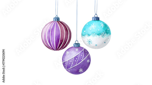 Three purple and blue watercolor Christmas ornaments with festive snowflake and stripe designs hang delicately for the holiday season