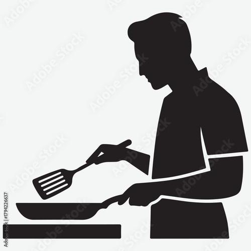 Silhouette of a man cooking with a spatula and frying pan