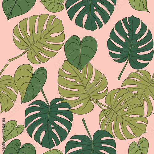 Tropical seamless pattern with various green monstera and philodendron leaves scattered on a soft, solid pink background for decor.