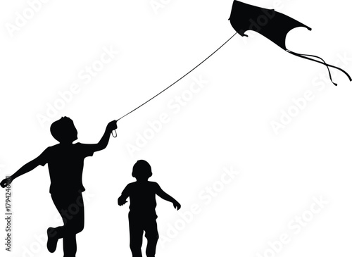 Joyful children running and flying a kite on a bright sunny day.