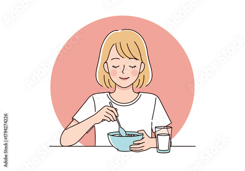 Young woman eating breakfast from a bowl with a spoon, a glass of milk beside her, representing a healthy start to the day