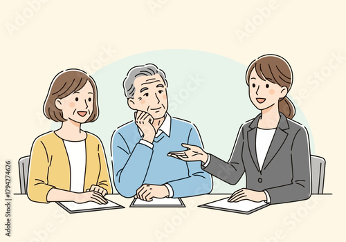 Financial advisor explaining something to an elderly couple, who are listening attentively