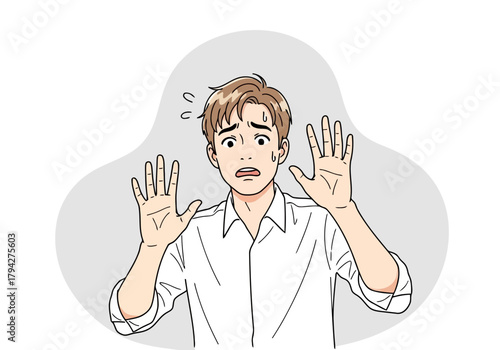 Man looking scared with hands up in surprise or fear