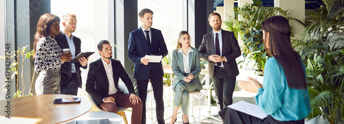 Εκτύπωση καμβά Businesswoman conducting a work conference or meeting for a team of colleagues in an office