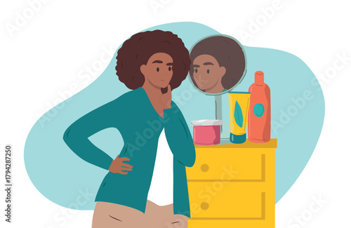 Photos A woman looks in the mirror with displeasure while choosing cosmetics