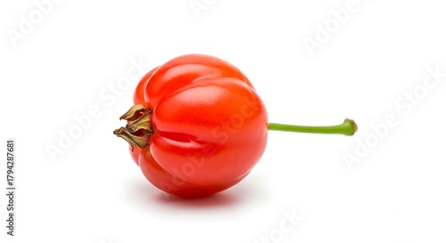 A single red acerola cherry isolated on white background