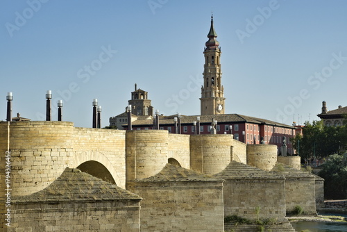 View of the stone bridge and the tower of the cathedral in Zaragoza, Spain