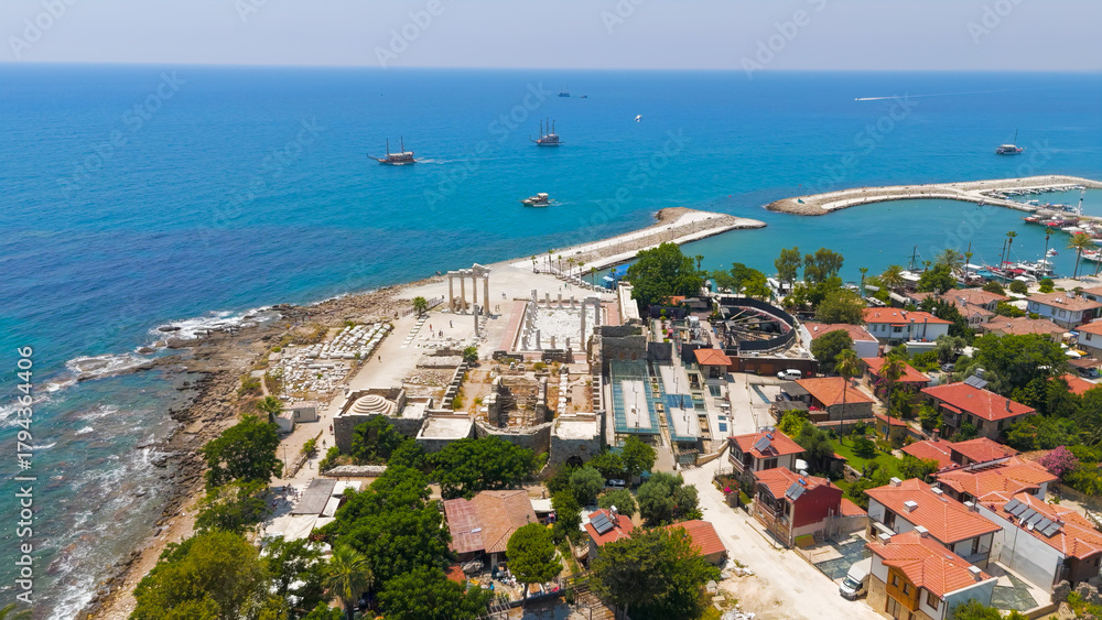 Naklejka premium Side, Manavgat, Turkey. Temple of Apollo and Athena near harbor, South Basilica. On shore, ancient ruins and Mediterranean coast aerial view on sunny day. Aerial View