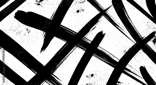 Abstract black and white background with bold brush strokes creating a dynamic, chaotic pattern.