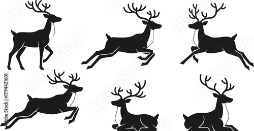 Set of 6 black stag or reindeer silhouettes. Isolated wild animal graphics for Christmas.