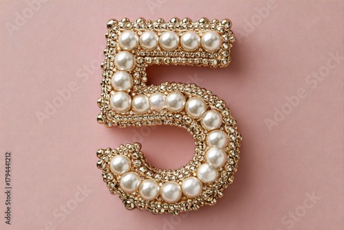 Elegant Number Five Decoration with Pearls and Gems on Pink Background