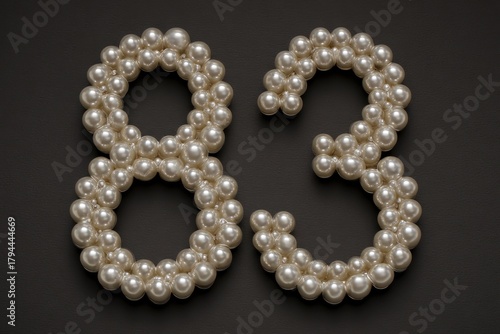 Elegant Pearls Forming Number Eight and Three on Dark Background