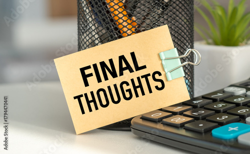 A small piece of paper with the words Final Thoughts written on it is sitting