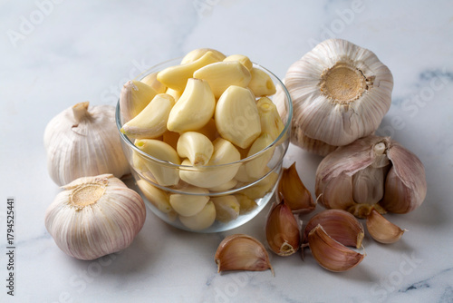 Garlic cloves in a glass bo...
