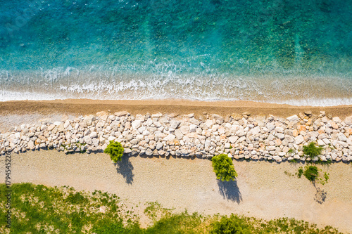 Beautiful beach in town of Crikvenica, Adriatic coastline in Croatia, drone overhead view 