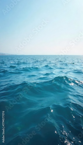 Vast, tranquil ocean stretching to the hazy horizon Perfect for travel, nature, or serenity themes Captures the calming beauty of the sea meeting the sky , tranquility, breathtaking, vast