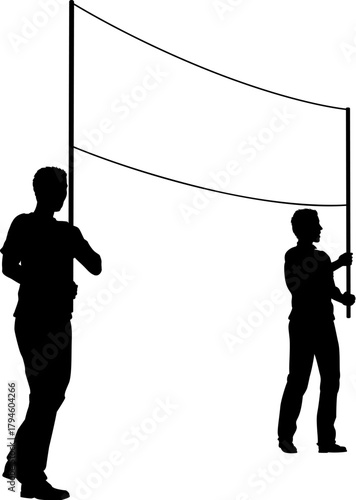 Two protestors or demonstrators at a demonstration march, picket line or strike protest rally in silhouette. Holding up a banner sign.