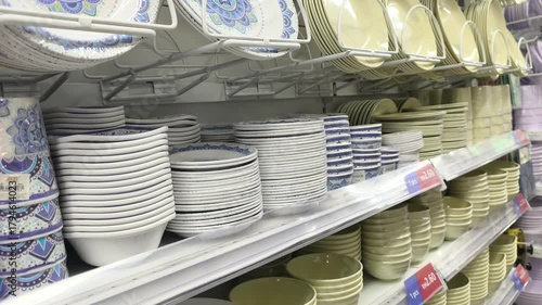 Seremban, Malaysia - August 13, 2025: Plates and bowls of various sizes, patterns, and designs are displayed on store shelves. 