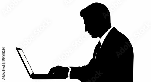 silhouette of a man with laptop