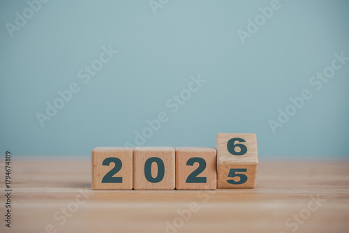 Wooden cube blocks for the transition from 2025 to 2026. Countdown to 2026. Load year from 2025 to 2026. New year start concept.