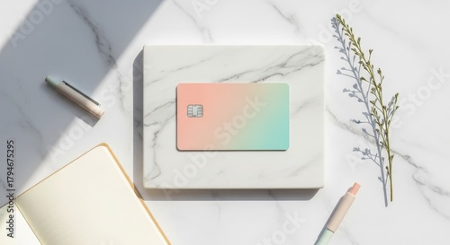 Pastel Credit Card on Marble with Notebook and Pen.