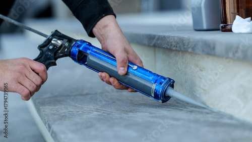 Photos Applying sealant with a caulking gun for home improvement and construction