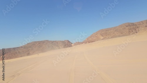 Rear view from off-road vehicle in the desert, Egypt