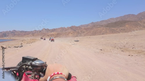 Driving a quad bike in the desert near Dahab, Egypt