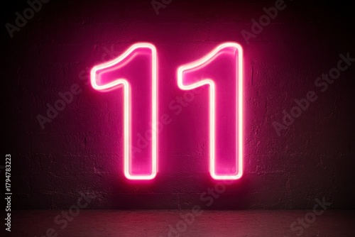 Neon Sign Illuminating the Number Eleven in Bright Pink Light